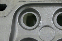Before: automotive aluminum engine block with casting defect